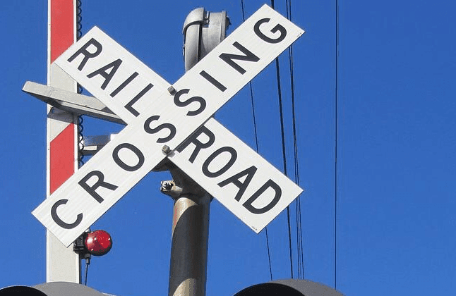 Driver hit by train after driving around warning device  image