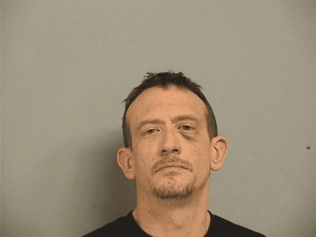 Man arrested after threatening others with gun, vandalizing hotel  image