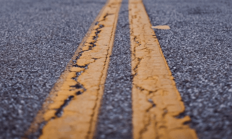 Woman hit by car after attacking man in parking lot image