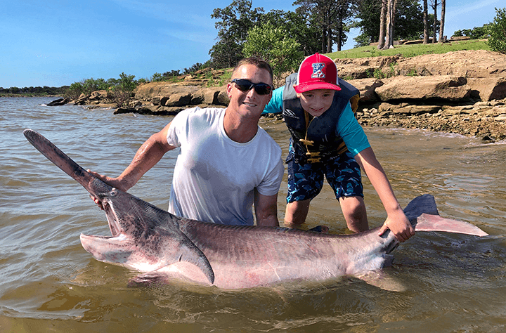 Kiefer angler busts state record with 143-pound paddlefish image