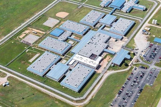 Three prisoners died at an Oklahoma private prison after guards skipped security checks and falsified records image