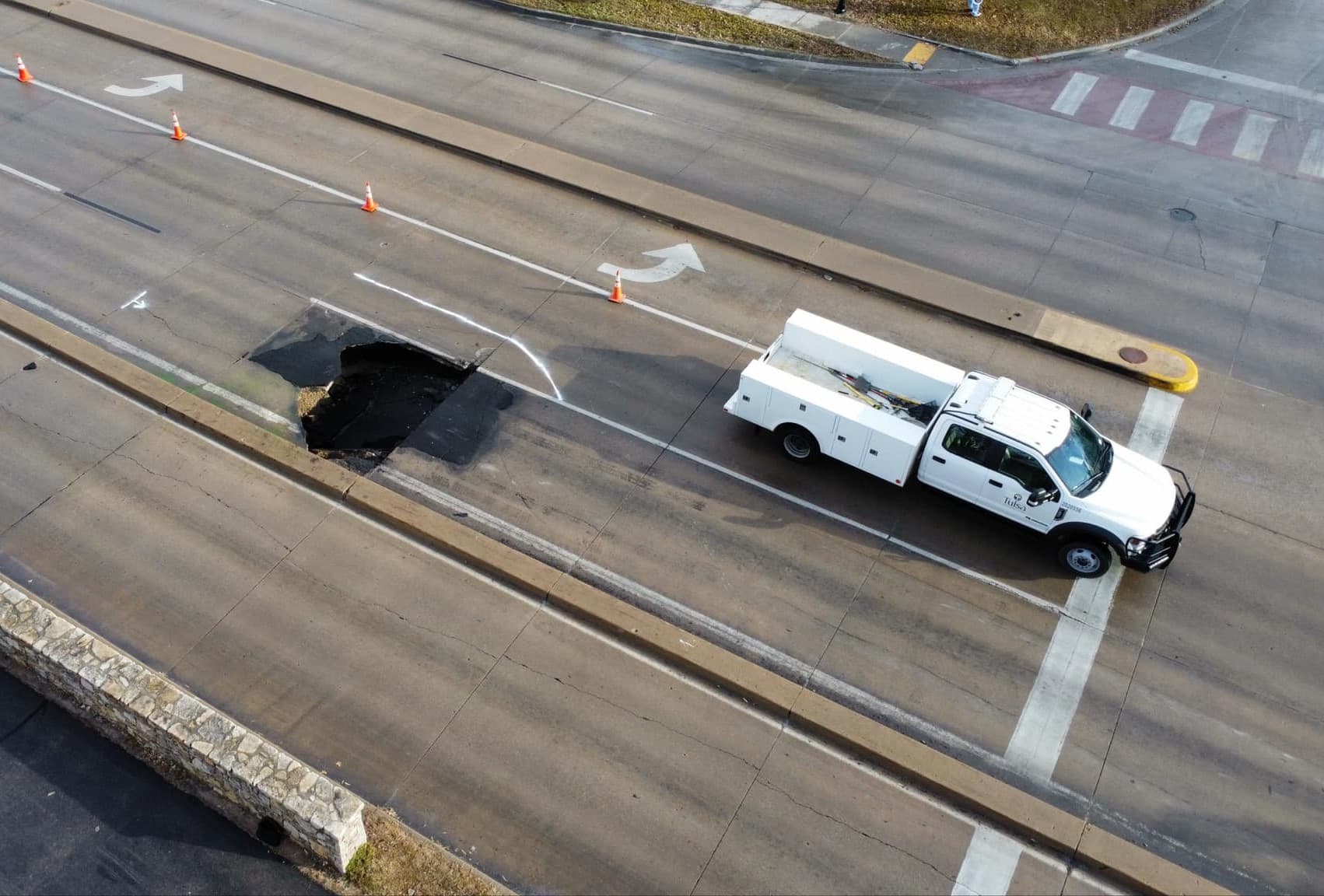 Crews investigating sinkhole at 21st and Riverside image