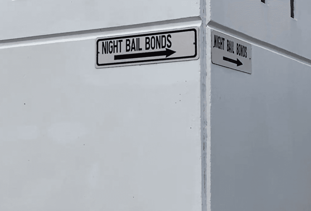 After arrest, low-income defendants may spend weeks or months in jail before they can request a lower bond image
