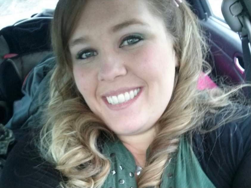 Woman arrested for killing her father, taking off with two kids image